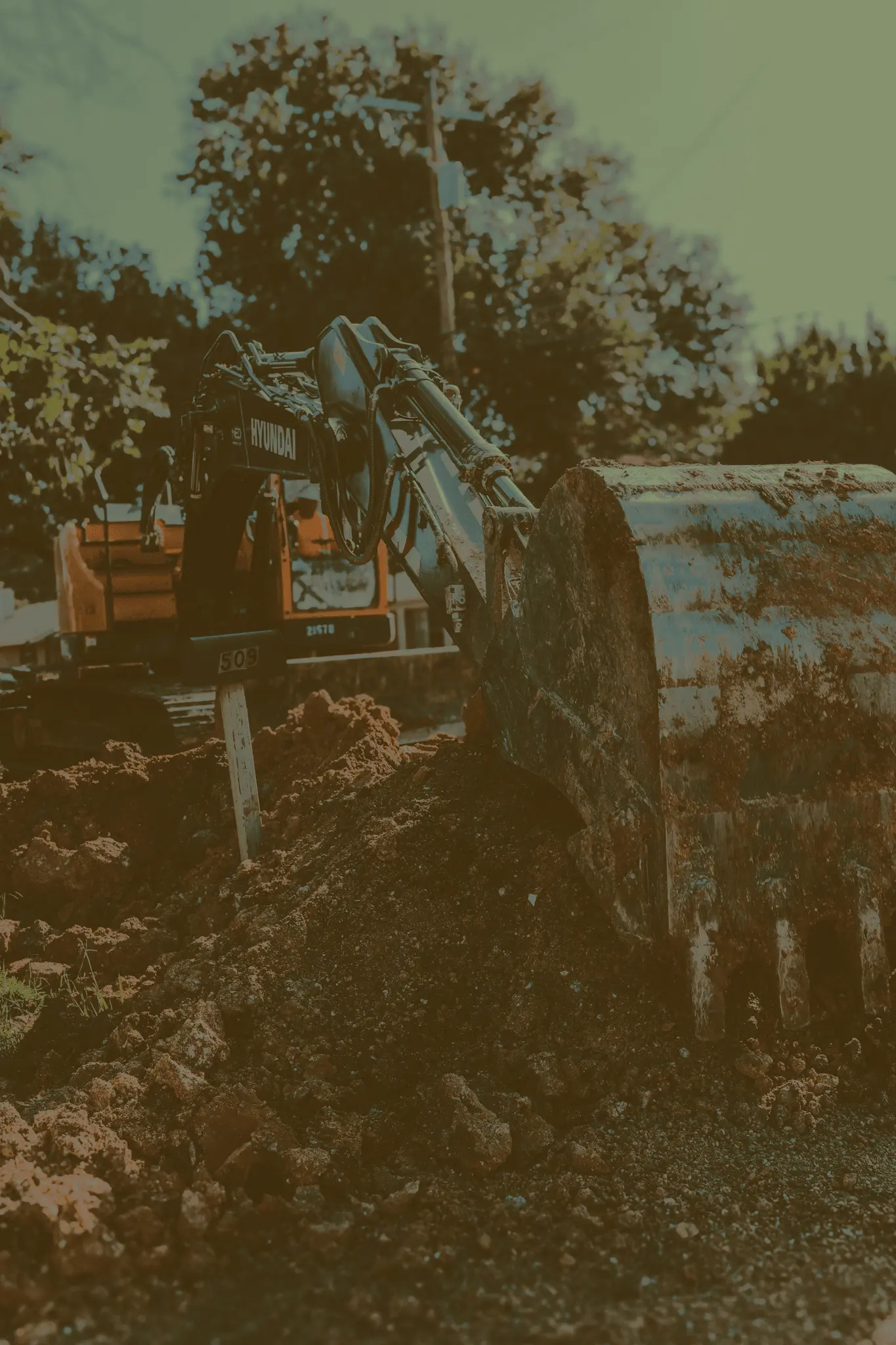 Excavator collecting dirt.